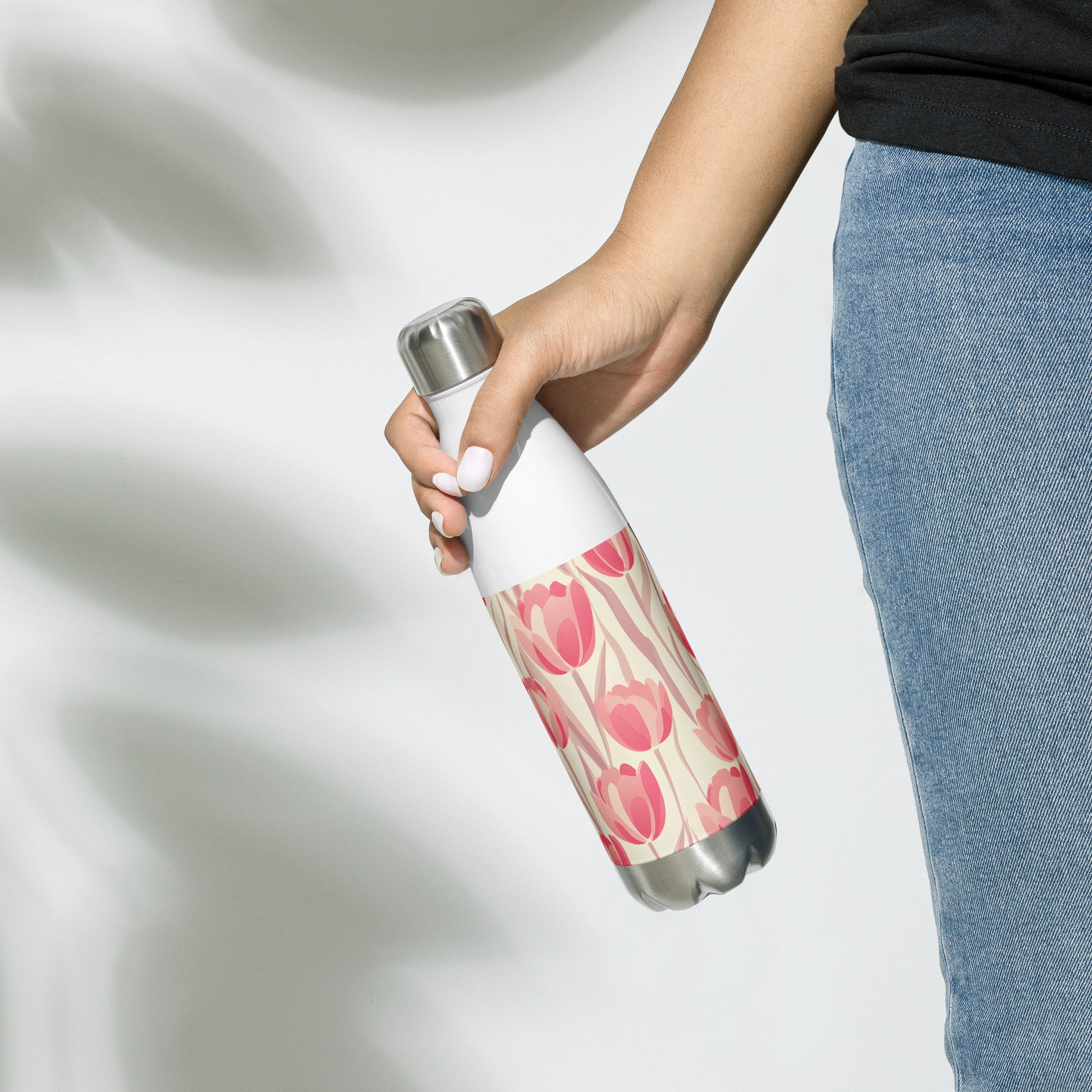 Lifestyle Image: Model carrying Block Print Pastel Pink Tulip Water Bottle